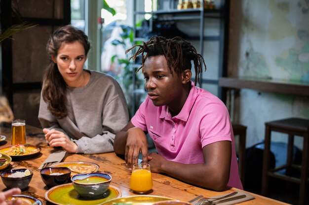 Highschool students having a lunch in a modern cafe