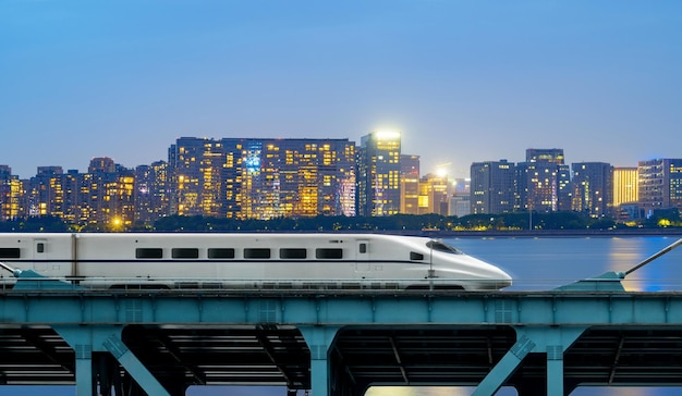 Highspeed rail speeds on Bridges and the modern city skyline of chongqing China