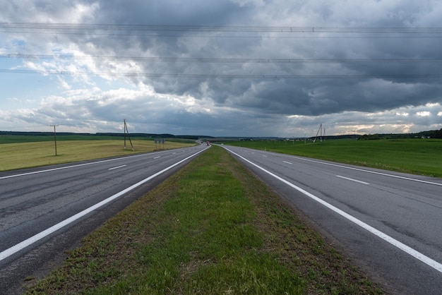 Highway before the storm. Dramatic clouds