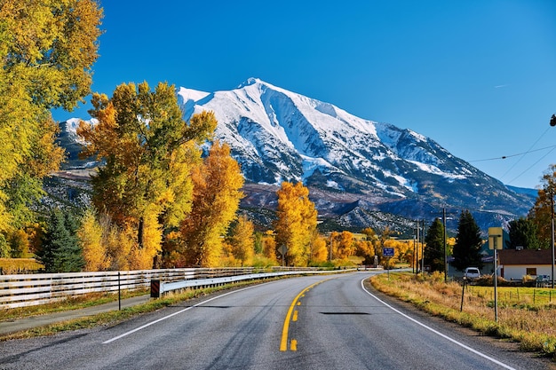 Highway in Colorado Rocky Mountains at autumn