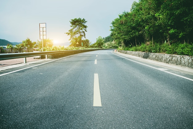 Highway and green mountain background