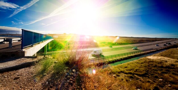 Highway traffic Road infrastructure and sunset