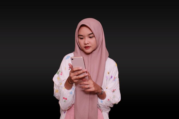 A hijab model holding a cell phone