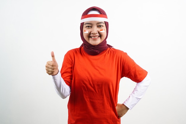 Hijab Woman is celebrating independence day with thumb up