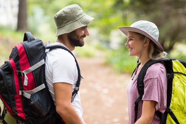hiker couple looking at each other