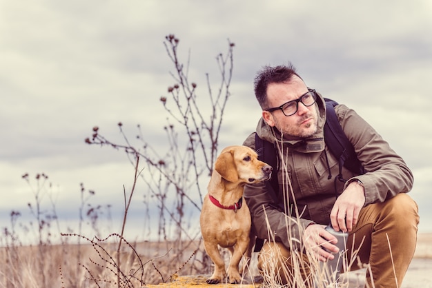 Hiker and dog resting