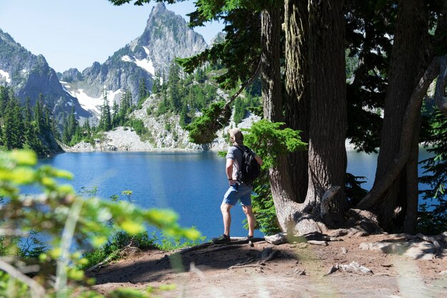 Hiker enjoying view of an alpine lake