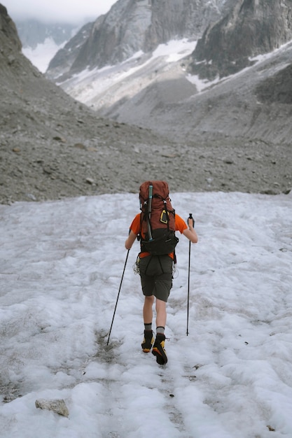 Hiker going up Chamonix Alps in France