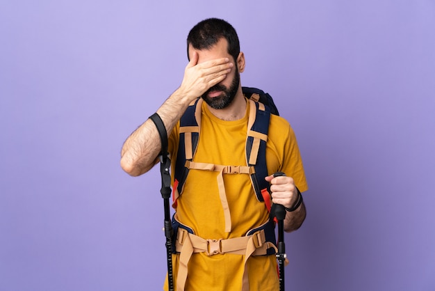 Hiker man over isolated purple background