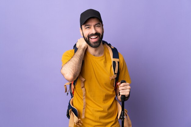 Hiker man over isolated purple background