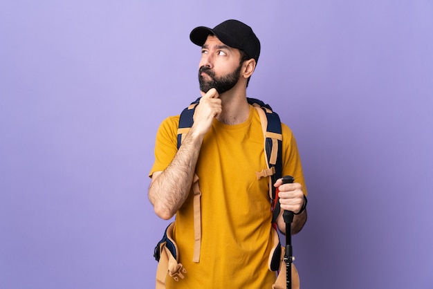 Hiker man over isolated wall