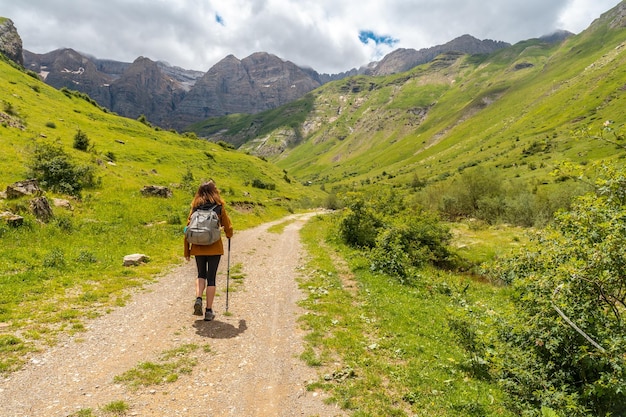 A hiker in the Ripera valley in the town of Panticosa in the Pyrenees Huesca