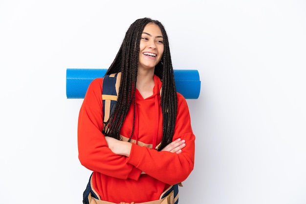 Hiker teenager girl with braids over isolated white background happy and smiling