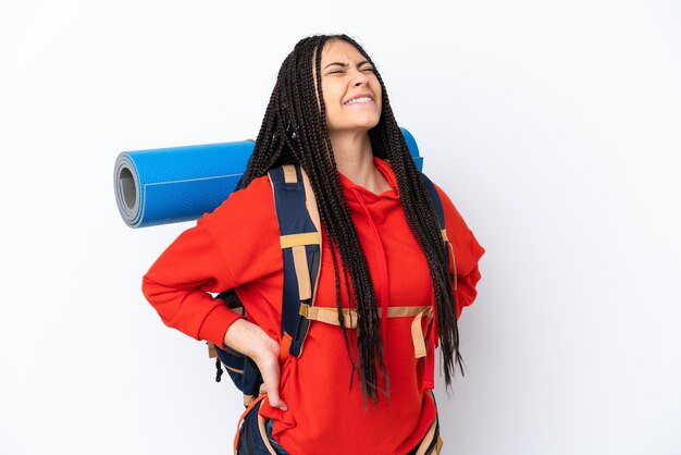 Hiker teenager girl with braids over isolated white background suffering from backache for having made an effort