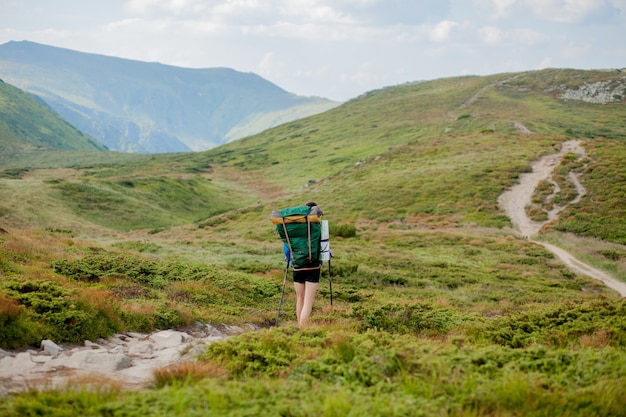 Hiker on the top in Carpathians mountains