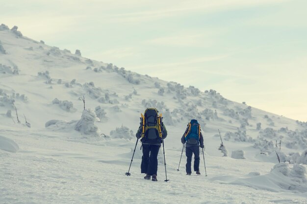 Hiker with snowshoes in winter