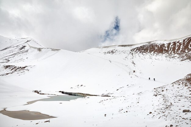 Hikers in the snowy mountains