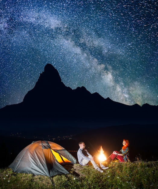 hikers under starry sky