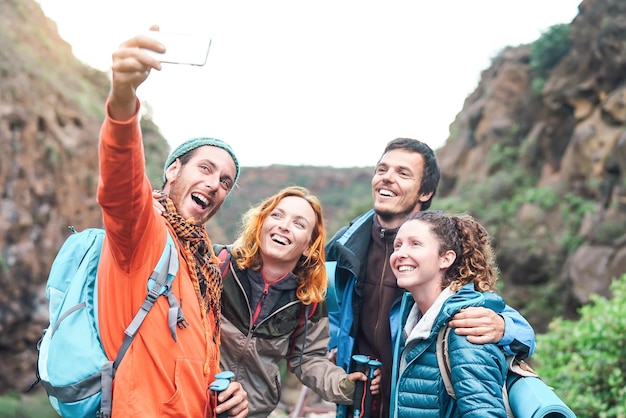 Hikers taking selfie on mountain