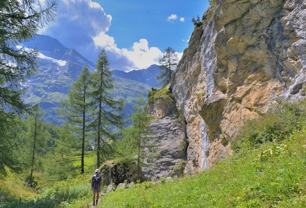 Hiking in alpine footpath