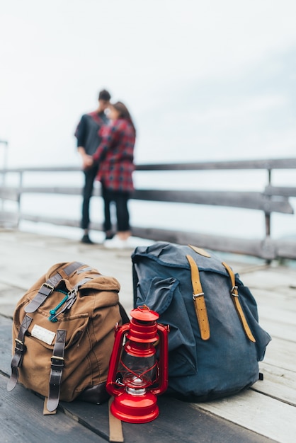 Hiking backpacks with a couple in the background