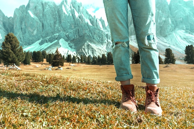 Hiking boots close-up. tourist walking at the Puez Odle. Italy