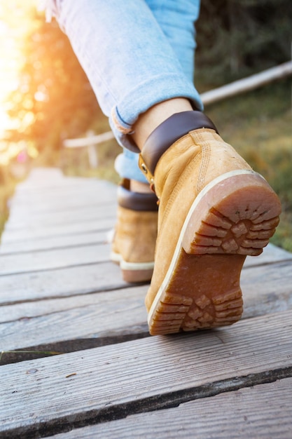 Hiking boots close-up. tourist walking on the trail. Italy