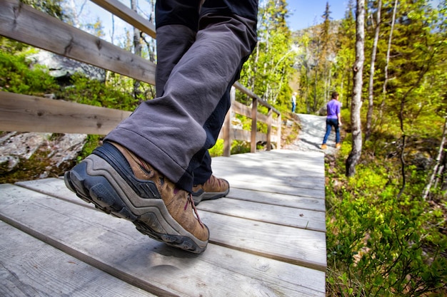 Hiking boots close-up. tourist walking on the trail. Italy