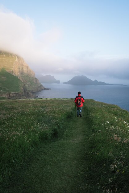 Hiking in the Gasadalur village Faroe Islands