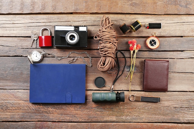 Hiking gear on wooden background