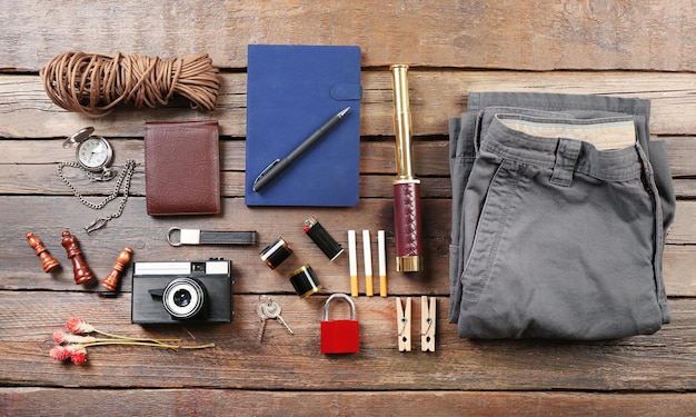 Hiking gear on wooden background