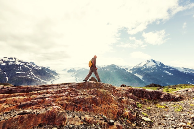 Hiking man in Canadian mountains. Hike is the popular recreation activity in North America. There are a lot of picturesque trails.