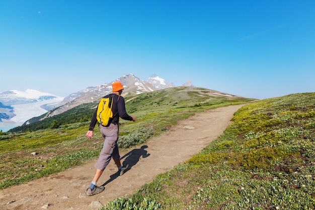 Hiking man in Canadian mountains. Hike is the popular recreation activity in North America. There are a lot of picturesque trails.