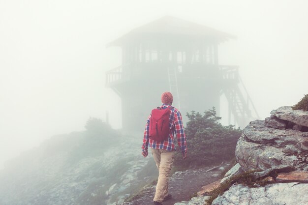 Hiking man in the mountains  outdoor active lifestyle travel adventure vacations summertime. Hike concept