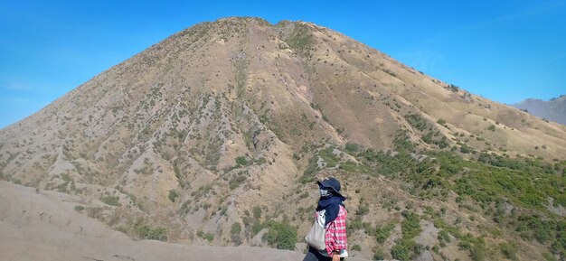 Hiking a mountain with blue sky