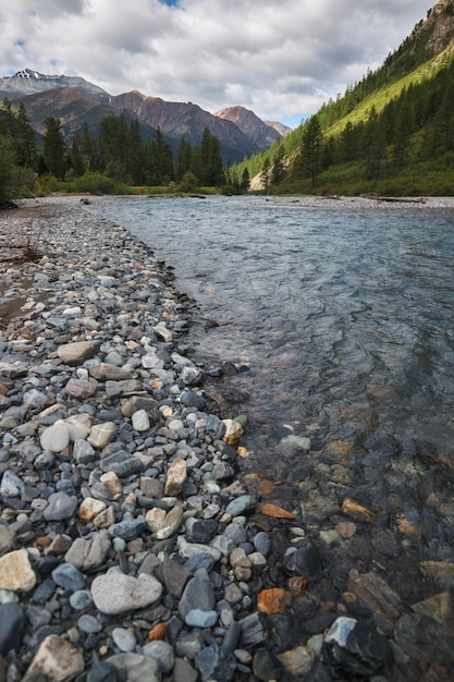 Hiking in the mountains Rivers and mountain lakes summer landscape of ridges and peaks An amazing journey