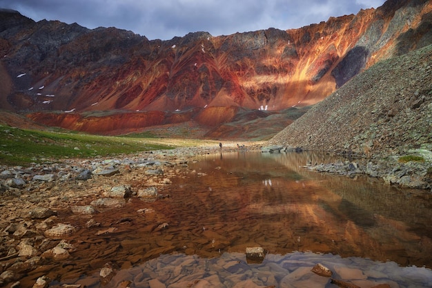 Hiking in the mountains Rivers and mountain lakes summer landscape of ridges and peaks An amazing journey