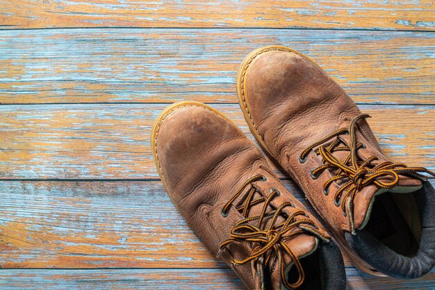 Hiking shoes laid on a wooden floor background