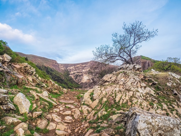 Hiking stone trail. Beautiful landscape view of the hiking trail on the rocky cliffs. Rocky road in Dagestan.