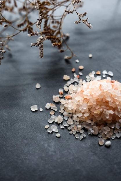 Himalayan pink salt in crystals closeup on a dark background