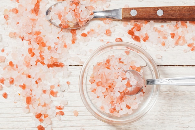 Himalayan salt on white wooden background