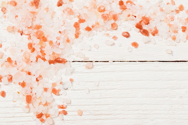 Himalayan salt on white wooden table