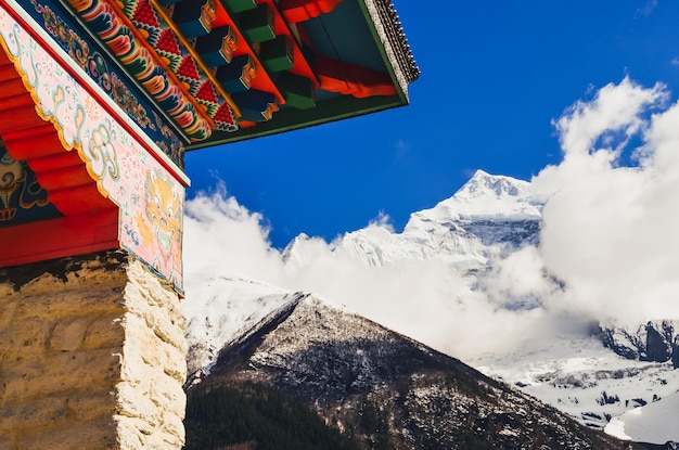 Himalayas mountain peak and buddhist temple colorful roof Nepal