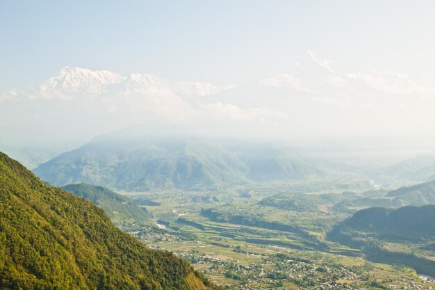 Himalayas range (Annapurna area) at sunrise and cloudy weather from Sarangkot, Nepal