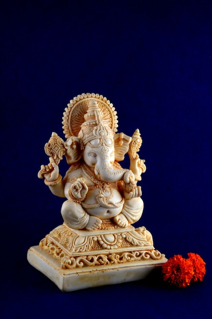 Hindu God Ganesha. Ganesha Idol on blue background