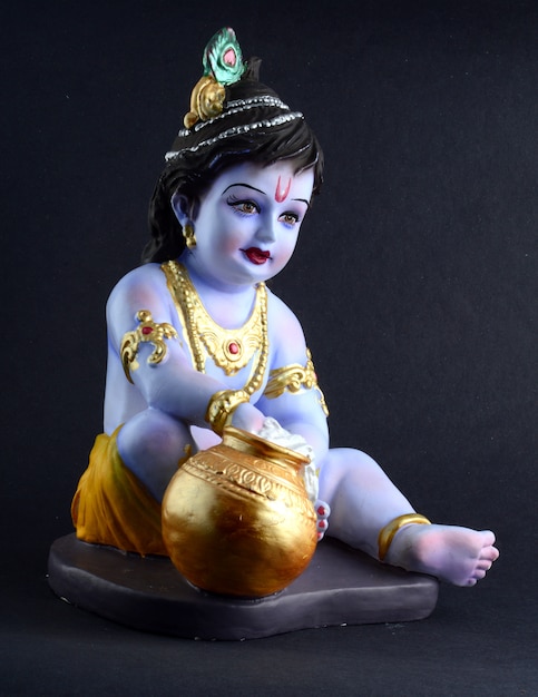 Hindu God Krishna on dark surface