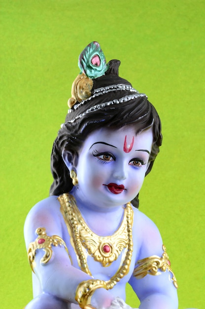 Hindu God Krishna on green surface