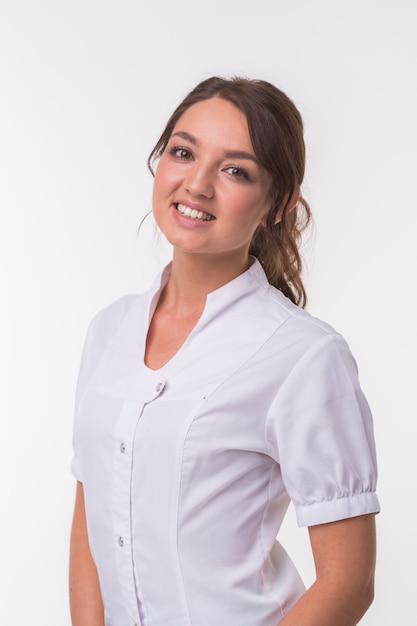 Hindu woman doctor standing over white background.