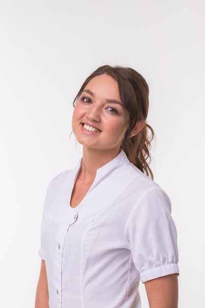 Hindu woman doctor standing over white background.