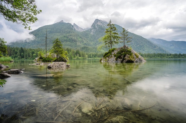 Hintersee Lake with reflection of Watzmann mountain peaks Ramsau Berchtesgaden Bavaria Germany Europ